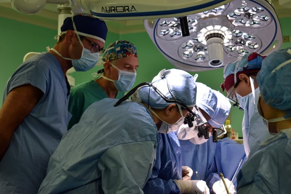 CEDIMAT Surgeons observe as Drs. Adams and Anyanwu perform a complex mitral valve repair during the May 2019 Mitral Foundation medical mission to the Dominican Republic. 