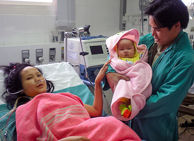A patient on the 2009 medical mission to Vietnam is reunited with her daughter after successful mitral valve repair surgery.