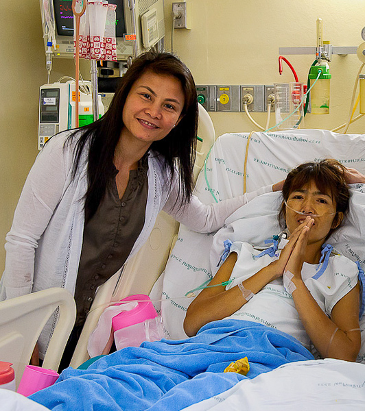 Mary Joy poses with a grateful patient during a 2011 medical mission to Thailand.